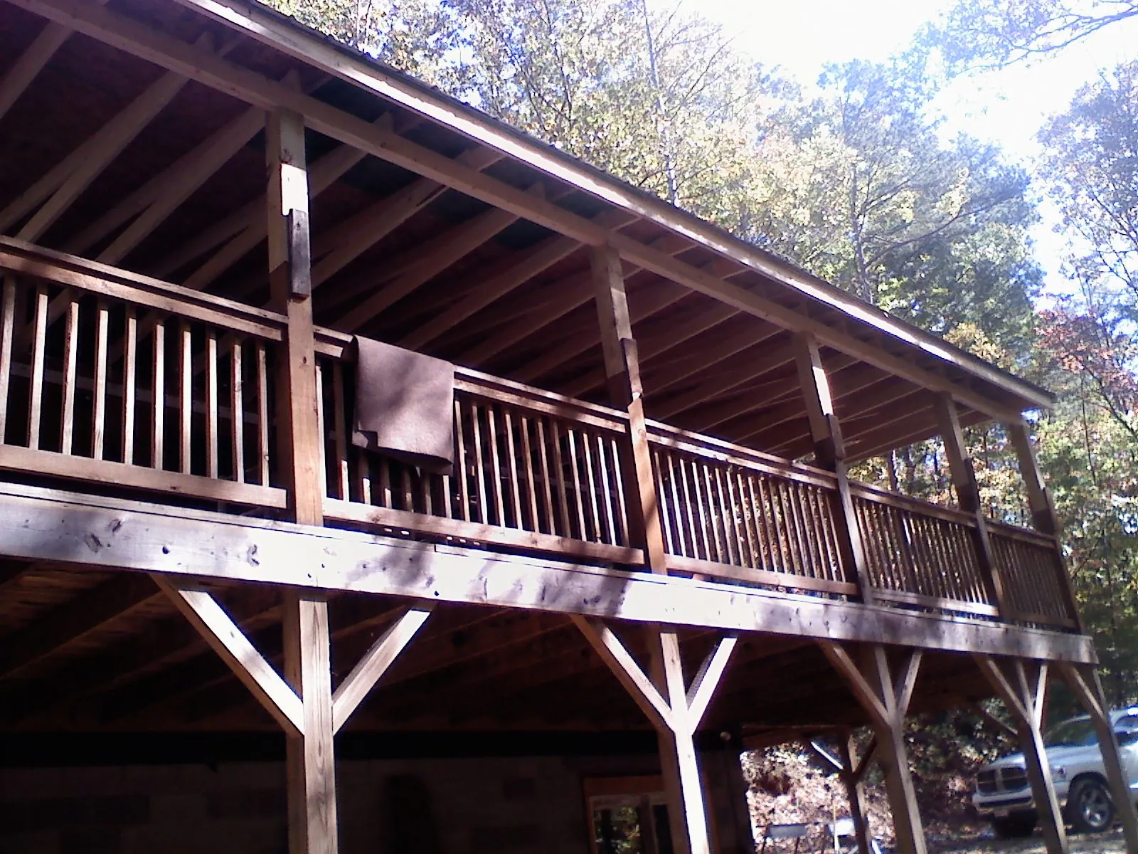 Timber framing under a new elevated porch and deck — Roof Leak Repair in Harrah by Roofing Brothers
